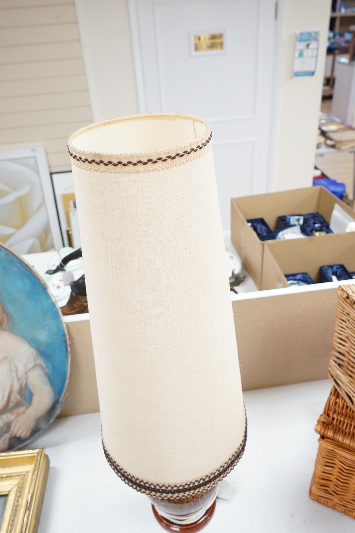 A mid century modern brown glazed ceramic table lamp and brown braided shade, 84cm including shade
